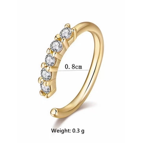Detailed view of gold S-shaped nose ring with five zircon stones, 0.8cm size and 0.3g weight