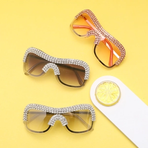 Detailed view of oversized punk sunglasses with rhinestones in multiple gradient colors
