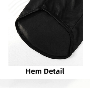 Detailed macro view of the black pet vest hem with smooth polyester stitching quality
