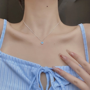 S925 sterling silver necklace with a blue heart-shaped moonstone pendant on model