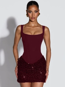Close-up of sparkling sequin embroidery on burgundy bodycon dress for party evening