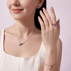 Floral S925 sterling silver jewelry set with purple petals on an elegant female model