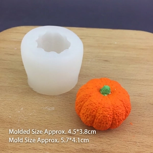 3D pumpkin silicone mold for candles and chocolate with size specs on wooden background