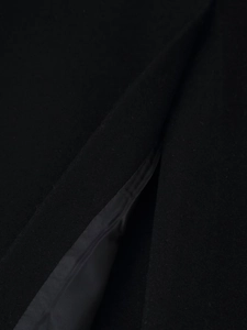 Close-up of high-quality stitching and inner lining on this black long wool coat