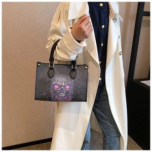 Detail of gothic skull print tote bag with purple lightning effect and dual handles