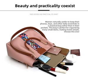 Top view of pink bucket bag showing large capacity with essentials and woven strap