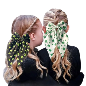 Elegant spring bow hair clips with green clover pattern for women on white background