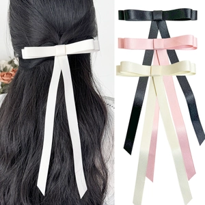 Elegant satin bow hair clip set with long ribbons in black, pink, and cream white colors