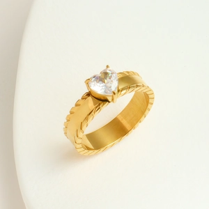 Elegant gold heart zircon ring with wide band and textured details in 45-degree view
