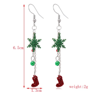 Detailed view of Christmas drop earrings with red socks and green bells measuring 6.5cm