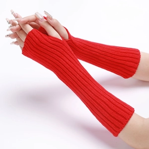 Detail of red ribbed knit fingerless gloves with thumb hole for winter warmth