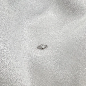 Macro detail of S925 sterling silver connector with round zircon for DIY jewelry