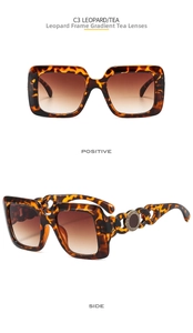 Detail view of leopard print square sunglasses with Greek meander hollow chain temples