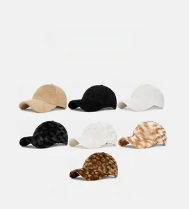 Detail showcasing velvet texture and stylish patterns on various baseball caps