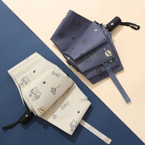 Automatic tri-fold umbrellas with cute cartoon cat patterns in dark blue and off-white
