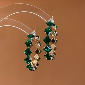 Elegant gold hoop earrings with emerald green square-cut crystals for women