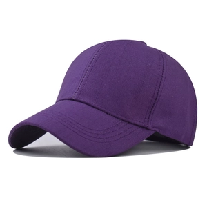 Detail view of deep purple baseball cap showing premium textured fabric and neat stitching