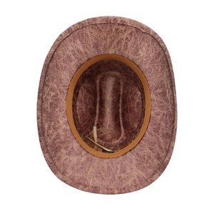 Close-up of brown vintage western cowboy hat featuring aged leather texture and sweatband