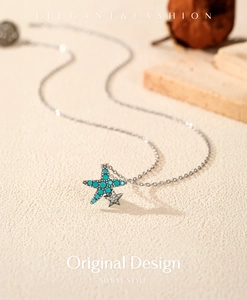 Detailed macro view of S925 silver starfish pendant necklace with turquoise beads