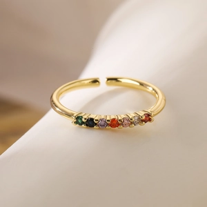 Close-up of 18K gold plated ring with seven multi-colored zircons and adjustable band