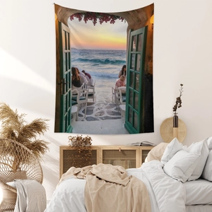 Detailed close-up of bohemian wall tapestry featuring a seaside sunset view in a bedroom setting