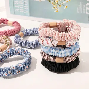 Set of colorful Korean style ruffled scrunchies with floral, plaid, and polka dot patterns