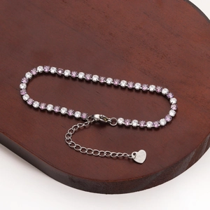 Detailed view of stainless steel tennis bracelet with pink zircon and heart lobster clasp