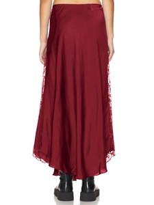 Detail of burgundy satin midi skirt featuring elegant lace stitching on the back