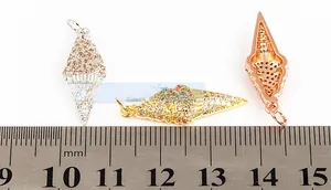 Macro view of gold-plated ice cream cone charms with micro-pave zircons and 22mm scale