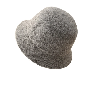 Women's warm dark grey knitted bucket hat with thick wool texture for winter style