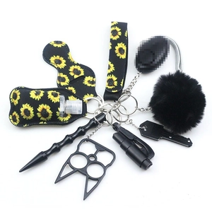 Sunflower pattern sanitizer bag with black safety tools and decorative keychain set