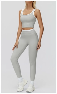 Close-up of contrast trim on high-waisted ribbed yoga leggings and cropped tank top set