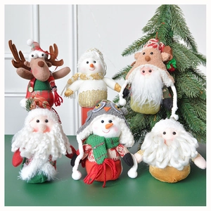 Detail of Christmas plush ornaments including Santa, snowman and reindeer figures