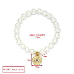 Detail view of 8mm pearl bracelet with evil eye charm showing 174mm inner perimeter