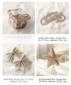 Close-up of golden glitter Christmas ornaments including star topper and Merry Christmas sign