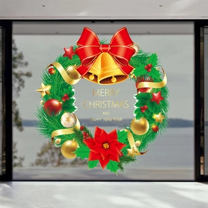 Christmas wreath window sticker with red bow, golden bells and Merry Christmas message