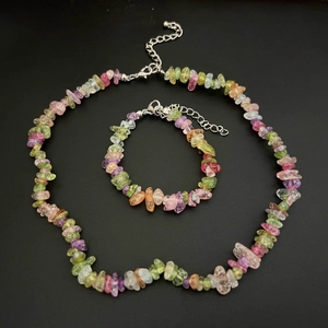 Detail view of multi-color natural gemstone chips necklace and bracelet jewelry set