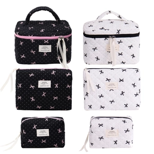 Pink polka dot bow makeup bag set with quilted fabric in multiple sizes and colors