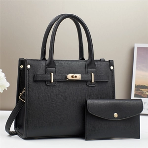 Classic black pebbled leather tote and pouch set with golden buckle for women