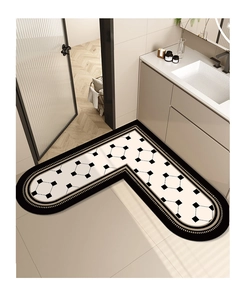 Close-up of L-shaped absorbent bathroom mat with black and white geometric pattern