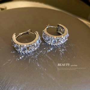 Sparkling silver C-shaped hoop earrings with micro-pave cubic zirconia crystals