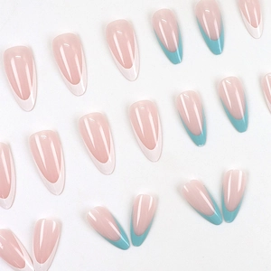 Almond-shaped French press-on nails in nude pink with white and mint green tips