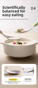 Detail view of 316L stainless steel baby spoon with ergonomic green handle and balanced weight