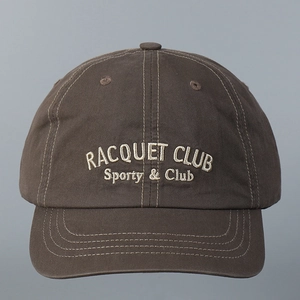 Close-up of embroidered Racquet Club lettering on vintage cotton short brim baseball cap