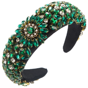 Detail of luxury emerald rhinestone headband with sunflower pattern and pearls