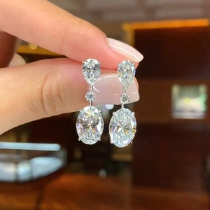 Elegant silver waterdrop earrings with tiered sparkling crystals for bridal jewelry