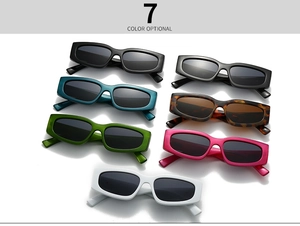Flat lay display of retro rectangular sunglasses in seven different vibrant colors