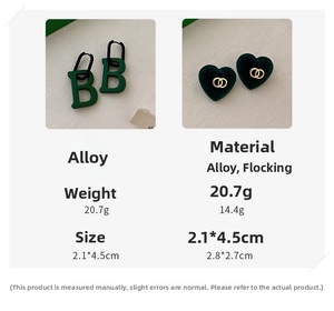 Detailed view of green acrylic earrings featuring a B-shaped pendant and flocked heart design