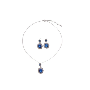 Elegant silver jewelry set with oval blue sapphire stones and diamond halo accents