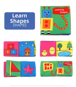 Detail of baby cloth book showing learning shapes, letters and colorful animal illustrations